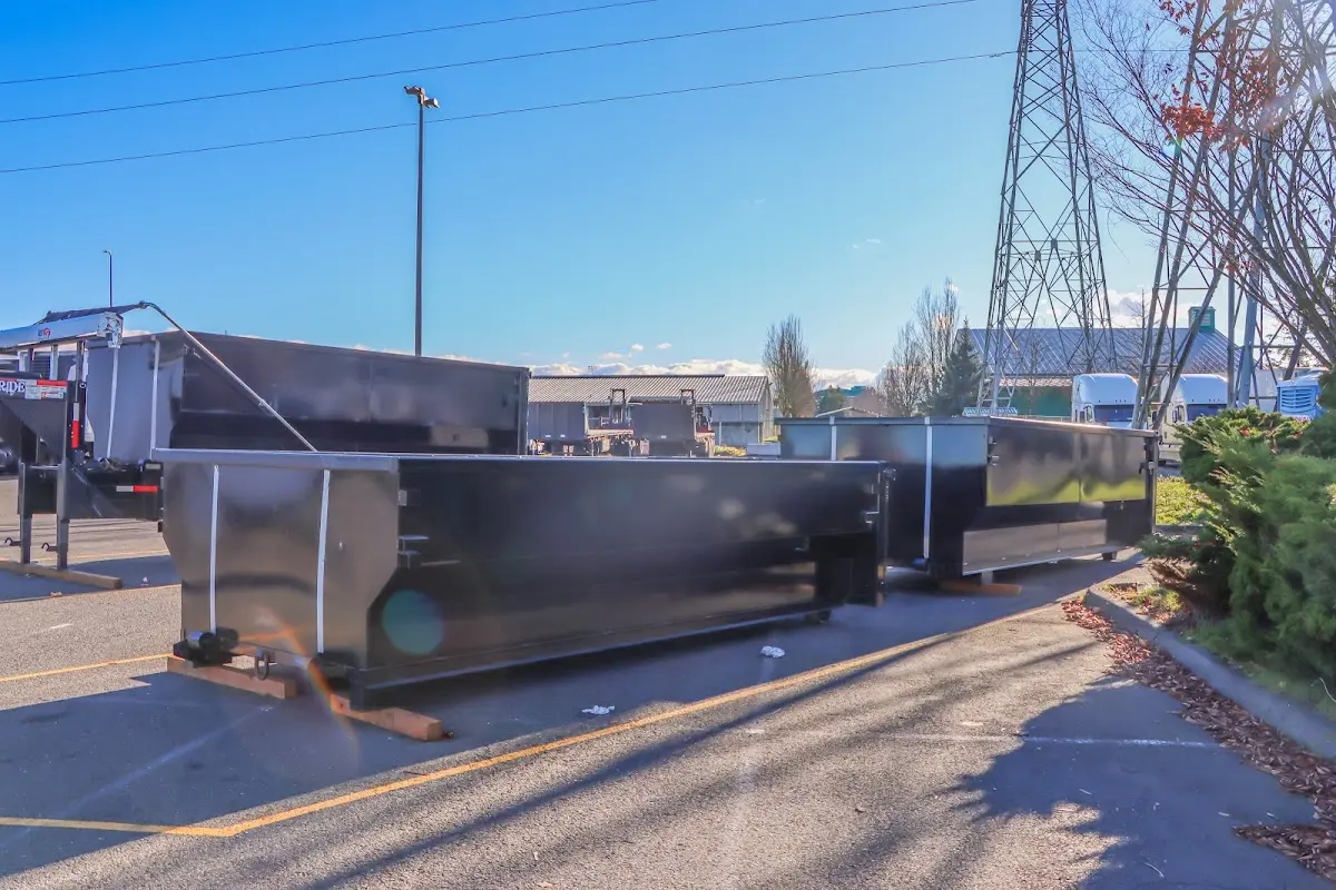 Roll-off dumpster ready for waste disposal at job site for Yard Waste Dumpster Rental in Grayling